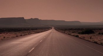 Movie still from “Rain Man” (1988), directed by Barry Levinson – An empty road in the middle of the desert; Extreme Wide shot, High angle
