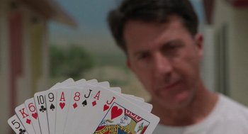 Movie still from “Rain Man” (1988), directed by Barry Levinson – A person holding a deck of cards; Close Up shot, Low angle