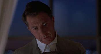 Movie still from “Rain Man” (1988), directed by Barry Levinson – A person wearing a suit and tie; Close Up shot, Low angle