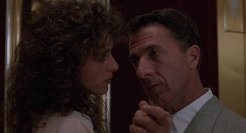 Movie still from “Rain Man” (1988), directed by Barry Levinson – A man and a woman looking at one another; Close Up shot, Low angle