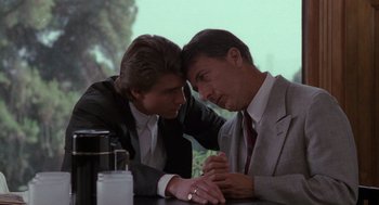 Movie still from “Rain Man” (1988), directed by Barry Levinson – A couple of men sitting at a table together; Close Up shot, Over the shoulder angle