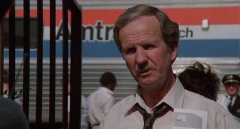 Movie still from “Rain Man” (1988), directed by Barry Levinson – An older man wearing a tie and a white shirt; Close Up shot, Low angle