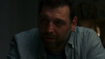 Movie still from “Rainbow” (2022), directed by Paco León – A person wearing a shirt; Close Up shot, Over the shoulder angle