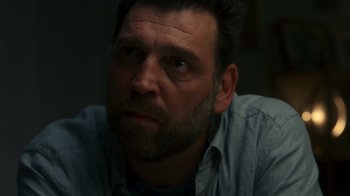 Movie still from “Rainbow” (2022), directed by Paco León – A person with a beard; Close Up shot, Over the shoulder angle