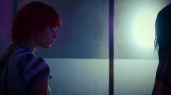 Movie still from “Rainbow” (2022), directed by Paco León – A woman with red hair is standing in front of a window; Close Up shot, Low angle