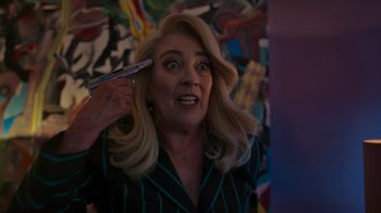 Movie still from “Rainbow” (2022), directed by Paco León – A woman with blonde long hair holding a hair brush; Close Up shot, Low angle