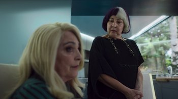 Movie still from “Rainbow” (2022), directed by Paco León – Two older women with long blonde hair , one of whom has purple hair , one of whom has white hair; Close Up shot, Over the shoulder angle
