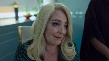 Movie still from “Rainbow” (2022), directed by Paco León – A person with long blonde hair; Close Up shot, Over the shoulder angle
