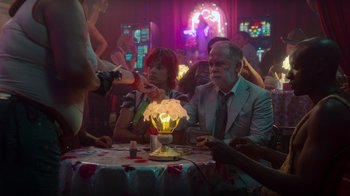 Movie still from “Rainbow” (2022), directed by Paco León – A man and a woman sitting at a dinner table; Medium shot, Over the shoulder angle