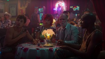 Movie still from “Rainbow” (2022), directed by Paco León – A man and woman sitting at a dinner table; Medium shot, Over the shoulder angle
