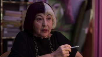 Movie still from “Rainbow” (2022), directed by Paco León – An older woman holding a cell phone in her hand; Close Up shot, Over the shoulder angle