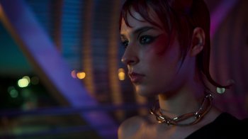 Movie still from “Rainbow” (2022), directed by Paco León – A person wearing a necklace; Close Up shot, Low angle