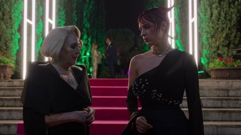 Movie still from “Rainbow” (2022), directed by Paco León – Two women standing next to each other in front of a red carpet; Medium shot, Over the shoulder angle
