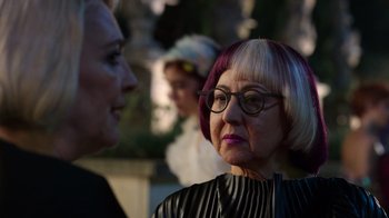 Movie still from “Rainbow” (2022), directed by Paco León – A woman with purple and white hair talking to another woman; Close Up shot, Over the shoulder angle