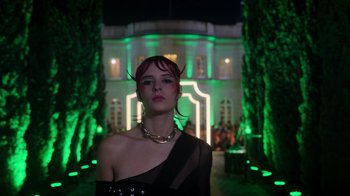 Movie still from “Rainbow” (2022), directed by Paco León – A woman with red hair wearing a black dress; Medium shot, Low angle
