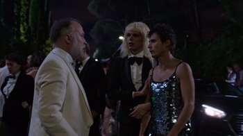 Movie still from “Rainbow” (2022), directed by Paco León – A group of people standing next to each other on a street; Medium shot, Over the shoulder angle