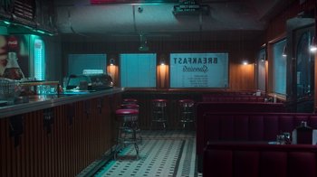 Movie still from “Rainbow” (2022), directed by Paco León – A room with a lot of chairs in it; Extreme Wide shot, High angle