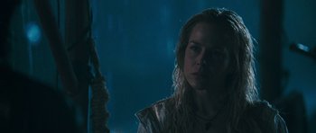 Movie still from “Rambo” (2008), directed by Sylvester Stallone – A person with long blonde hair; Close Up shot, Low angle