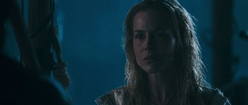 Movie still from “Rambo” (2008), directed by Sylvester Stallone – A person with long blonde hair; Close Up shot, Low angle