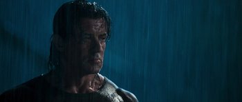 Movie still from “Rambo” (2008), directed by Sylvester Stallone – A person in the rain; Close Up shot, Low angle