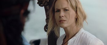 Movie still from “Rambo” (2008), directed by Sylvester Stallone – A person with long blonde hair; Close Up shot, Over the shoulder angle