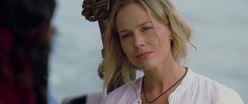 Movie still from “Rambo” (2008), directed by Sylvester Stallone – A person with long hair; Close Up shot, Over the shoulder angle