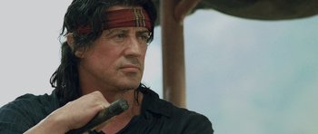 Movie still from “Rambo” (2008), directed by Sylvester Stallone – Sylvester stallone in rambo : first blood part ii; Close Up shot, Over the shoulder angle