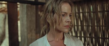 Movie still from “Rambo” (2008), directed by Sylvester Stallone – A person with long hair; Close Up shot, Low angle