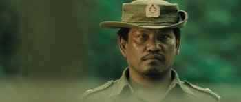 Movie still from “Rambo” (2008), directed by Sylvester Stallone – A person wearing a hat; Close Up shot, Low angle