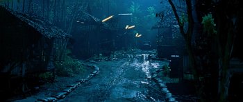 Movie still from “Rambo” (2008), directed by Sylvester Stallone – A street with a lot of lights on the ground; Extreme Wide shot, High angle