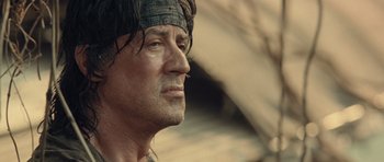 Movie still from “Rambo” (2008), directed by Sylvester Stallone – A person wearing a headband; Close Up shot, Low angle