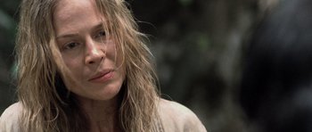 Movie still from “Rambo” (2008), directed by Sylvester Stallone – A person with long blonde hair; Close Up shot, Over the shoulder angle