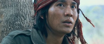 Movie still from “Rambo” (2008), directed by Sylvester Stallone – A person wearing a hat; Close Up shot, Low angle