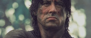 Movie still from “Rambo” (2008), directed by Sylvester Stallone – A man's face with wet hair; Close Up shot, Low angle