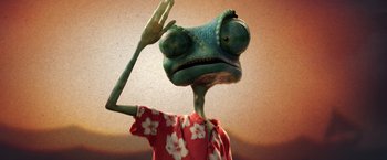 Movie still from “Rango” (2011), directed by Gore Verbinski – A green lizard wearing a hawaiian shirt and holding a peace sign; Extreme Close Up shot, Low angle