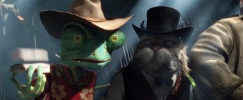 Movie still from “Rango” (2011), directed by Gore Verbinski – A lizard and a cat wearing a hat and a suit; Close Up shot, Low angle