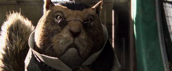 Movie still from “Rango” (2011), directed by Gore Verbinski – A cat wearing a tie and glasses; Close Up shot, Low angle