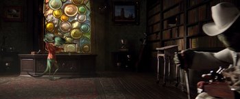 Movie still from “Rango” (2011), directed by Gore Verbinski – A room filled with lots of books and a painting; Wide shot, High angle
