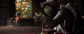 Movie still from “Rango” (2011), directed by Gore Verbinski – A person holding a wine glass in their hands; Medium shot, Low angle