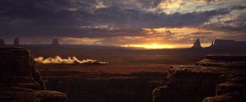 Movie still from “Rango” (2011), directed by Gore Verbinski – A train traveling through the desert at sunset; Extreme Wide shot, Low angle