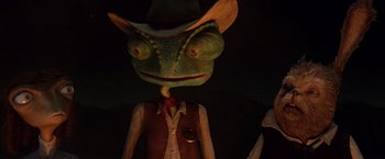 Movie still from “Rango” (2011), directed by Gore Verbinski – The head of a lizard wearing a cowboy hat; Close Up shot, Low angle