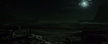 Movie still from “Rango” (2011), directed by Gore Verbinski – A person standing on top of a dirt field; Extreme Wide shot, High angle
