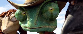 Movie still from “Rango” (2011), directed by Gore Verbinski – A green lizard wearing a hat; Extreme Close Up shot, Overhead angle