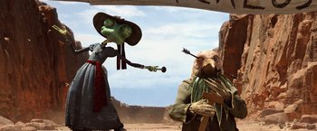 Movie still from “Rango” (2011), directed by Gore Verbinski – A group of people standing next to each other on a dirt field; Medium shot, Low angle