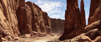Movie still from “Rango” (2011), directed by Gore Verbinski – A dirt field with a mountain in the background; Extreme Wide shot, High angle