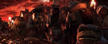 Movie still from “Rango” (2011), directed by Gore Verbinski – A group of people standing next to each other in the dark; Medium shot, Low angle