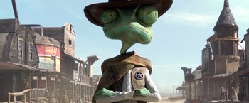 Movie still from “Rango” (2011), directed by Gore Verbinski – A statue of a lizard wearing a cowboy hat; Close Up shot, Low angle