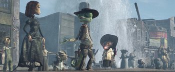 Movie still from “Rango” (2011), directed by Gore Verbinski – A group of people standing next to each other in front of a waterfall; Wide shot, Low angle