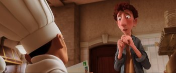 Movie still from “Ratatouille” (2007), directed by Jan Pinkava – A couple of people standing next to each other in a room; Medium shot, Over the shoulder angle