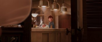 Movie still from “Ratatouille” (2007), directed by Jan Pinkava – Two people are cooking in a kitchen with lights on; Medium shot, Over the shoulder angle